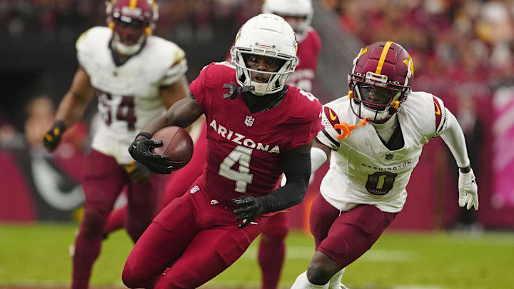 Cardinals receiver Greg Dortch (4) sprints upfield for a first down against the Commanders during a game at State Farm Stadium in Glendale on Sept. 29, 2024.