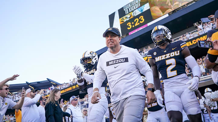 Sep 7, 2024; Columbia, Missouri, USA; Missouri Tigers head coach Eli Drinkwitz runs out with the team against the Buffalo Bulls prior to a game at Faurot Field at Memorial Stadium. Mandatory Credit: Denny Medley-Imagn Images