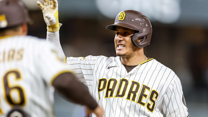 Apr 16, 2026; San Diego, California, USA; San Diego Padres third baseman Manny Machado (13) celebrats after hitting a RBI infield single during the seventh inning against the Seattle Mariners at Petco Park. Mandatory Credit: David Frerker-Imagn Images