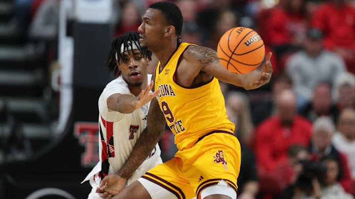 Feb 12, 2025; Lubbock, Texas, USA;  Arizona State Sun Devils center Shawn Phillips Jr. (9) works the ball against Texas Tech Red Raiders forward JT Toppin (15) in the first half at United Supermarkets Arena. Mandatory Credit: Michael C. Johnson-Imagn Images