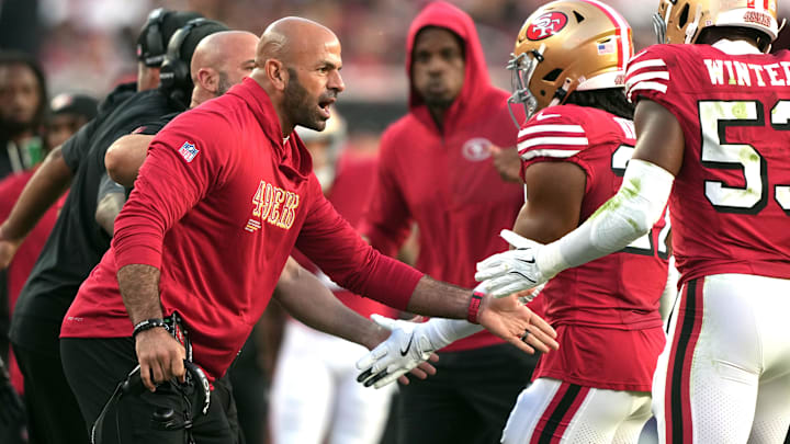 Oct 19, 2025; Santa Clara, California, USA; San Francisco 49ers defensive coordinator Robert Saleh (left) congratulates linebacker Dee Winters (right) during the second quarter against the Atlanta Falcons at Levi's Stadium. Mandatory Credit: Darren Yamashita-Imagn Images