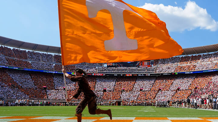 Davy Crockett runs the Power T flag across the end zone after a Tennessee touchdown during a college football game between Tennessee and Georgia at Neyland Stadium in Knoxville, Tenn., on Sept. 13, 2025. Davy Crockett runs the Power T flag across the end zone after a Tennessee touchdown during a college football game between Tennessee and Georgia at Neyland Stadium in Knoxville, Tenn., on Sept. 13, 2025.