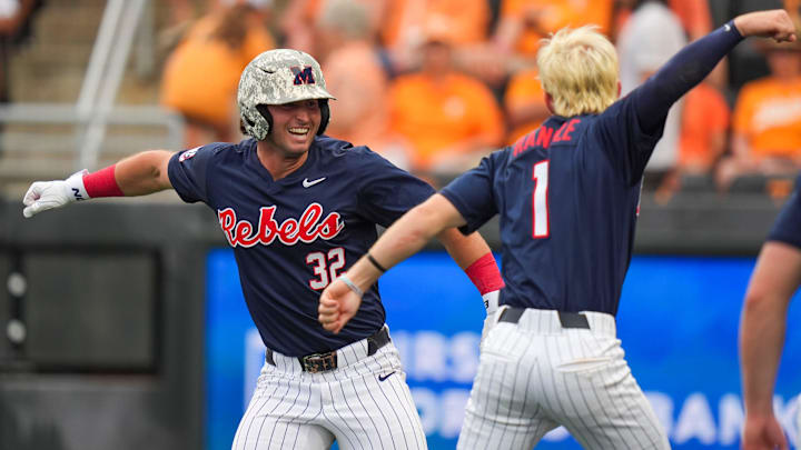 Ole Miss outfielder Tristan Bissetta (32) and Ole Miss infielder Brayden Randle (1) celebrate after Bissetta hits a grand slam against Tennessee.