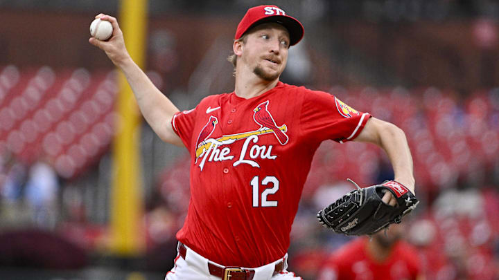 Aug 7, 2024; St. Louis, Missouri, USA;  St. Louis Cardinals starting pitcher Erick Fedde (12) pitches against the Tampa Bay Rays during the first inning at Busch Stadium. Mandatory Credit: Jeff Curry-Imagn Images