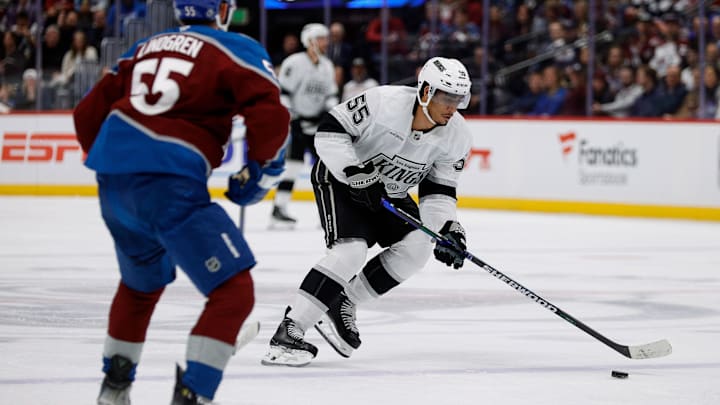 Mar 27, 2025; Denver, Colorado, USA; Los Angeles Kings right wing Quinton Byfield (55) controls the puck as Colorado Avalanche defenseman Ryan Lindgren (55) defends in the third period at Ball Arena. Mandatory Credit: Isaiah J. Downing-Imagn Images