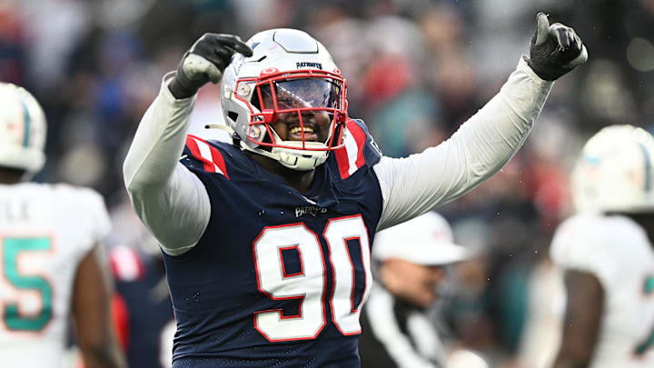 Jan 1, 2023; Foxborough, Massachusetts, USA; New England Patriots defensive tackle Christian Barmore (90) reacts after a sack against the Miami Dolphins during the second half at Gillette Stadium. Mandatory Credit: Brian Fluharty-Imagn Images