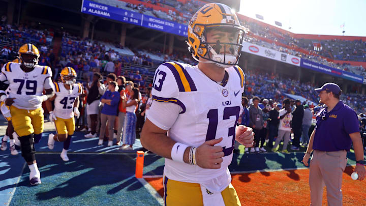 Nov 16, 2024; Gainesville, Florida, USA; LSU Tigers quarterback Garrett Nussmeier (13) runs onto the field against the Florida Gators prior to the game at Ben Hill Griffin Stadium. Mandatory Credit: Kim Klement Neitzel-Imagn Images Nov 16, 2024; Gainesville, Florida, USA; LSU Tigers quarterback Garrett Nussmeier (13) runs onto the field against the Florida Gators prior to the game at Ben Hill Griffin Stadium. Mandatory Credit: Kim Klement Neitzel-Imagn Images