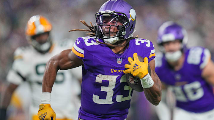 Dec 29, 2024; Minneapolis, Minnesota, USA; Minnesota Vikings running back Aaron Jones (33) runs with the ball against Green Bay Packers in the third quarter at U.S. Bank Stadium. Mandatory Credit: Brad Rempel-Imagn Images Dec 29, 2024; Minneapolis, Minnesota, USA; Minnesota Vikings running back Aaron Jones (33) runs with the ball against Green Bay Packers in the third quarter at U.S. Bank Stadium. Mandatory Credit: Brad Rempel-Imagn Images