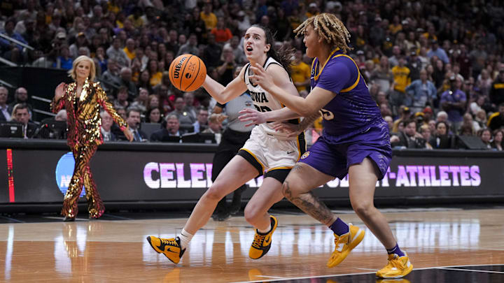 Apr 2, 2023; Dallas, TX, USA; Iowa Hawkeyes guard Caitlin Clark drives to the basket against LSU Lady Tigers guard Kateri Poole.
