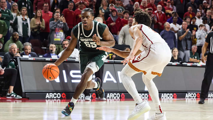 Feb 1, 2025; Los Angeles, California, USA;  Michigan State Spartans forward Coen Carr (55) dribbles the ball against the USC Trojans during the second half  at Galen Center. Mandatory Credit: William Navarro-Imagn Images
