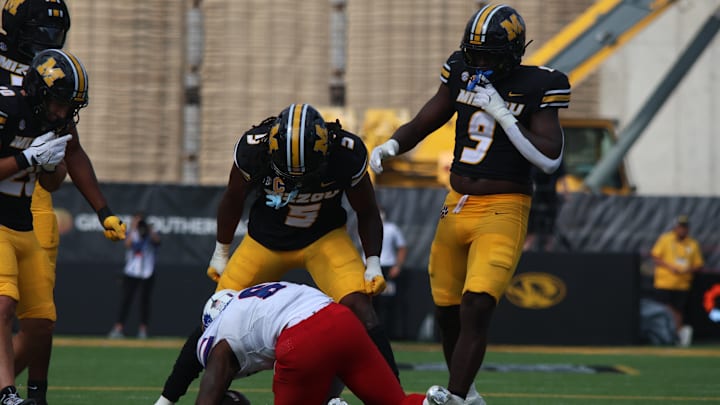 Sep 6, 2025; Columbia, Missouri, USA; Missouri Tigers linebacker Khalil Jacobs (5) celebrates a tackle against the Kansas Jayhawks in the first quarter of the Border War at Faurot Field at Memorial Stadium. Sep 6, 2025; Columbia, Missouri, USA; Missouri Tigers linebacker Khalil Jacobs (5) celebrates a tackle against the Kansas Jayhawks in the first quarter of the Border War at Faurot Field at Memorial Stadium.
