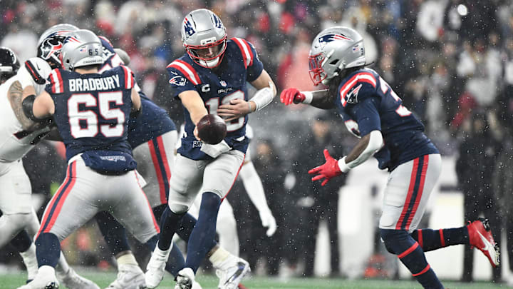 Jan 18, 2026; Foxborough, MA, USA; New England Patriots quarterback Drake Maye (10) hands off the ball in the third quarter against the Houston Texans in an AFC Divisional Round game at Gillette Stadium. Mandatory Credit: Brian Fluharty-Imagn Images