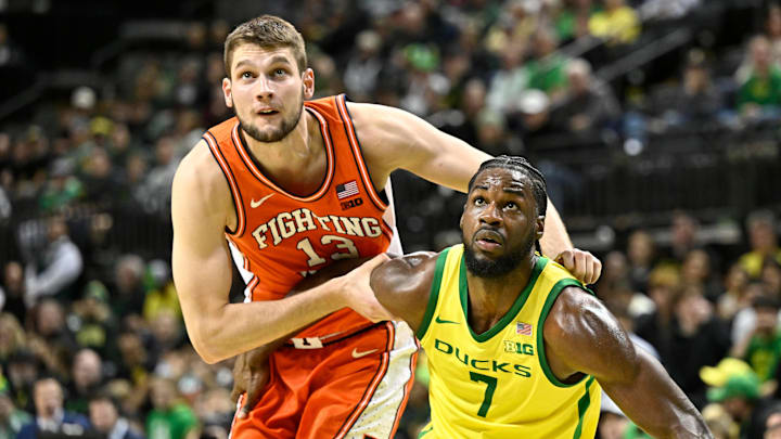 Jan 2, 2025; Eugene, Oregon, USA; Illinois Fighting Illini center Tomislav Ivisic (13) battles for rebound position with Oregon Ducks forward Supreme Cook (7) during the second half at Matthew Knight Arena. Mandatory Credit: Craig Strobeck-Imagn Images