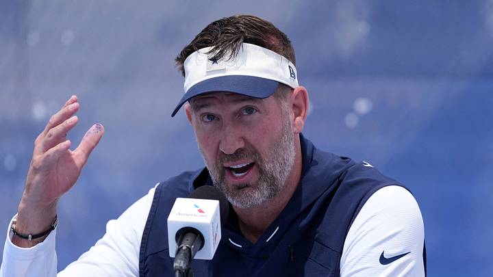 Dallas Cowboys coach Brian Schottenheimer at training camp opening press conference at River Ridge Playing Fields. Dallas Cowboys coach Brian Schottenheimer at training camp opening press conference at River Ridge Playing Fields.