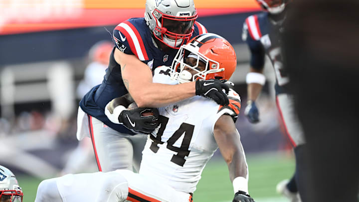 Oct 26, 2025; Foxborough, Massachusetts, USA;  New England Patriots linebacker Robert Spillane (14) tackles Cleveland Browns tight end Harold Fannin Jr. (44) during the fourth quarter at Gillette Stadium. Mandatory Credit: Brian Fluharty-Imagn Images