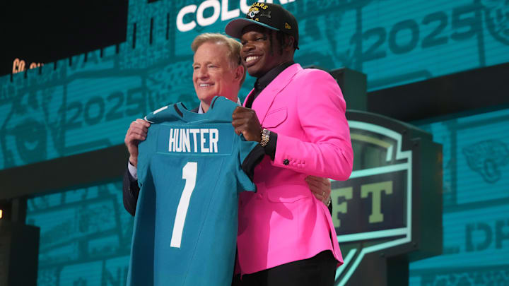 Apr 24, 2025; Green Bay, WI, USA; NFL commissioner Roger Goodell stands with Colorado Buffaloes wide receiver Travis Hunter after he is selected by the Jacksonville Jaguars as the number two pick in the first round of the 2025 NFL Draft at Lambeau Field. 