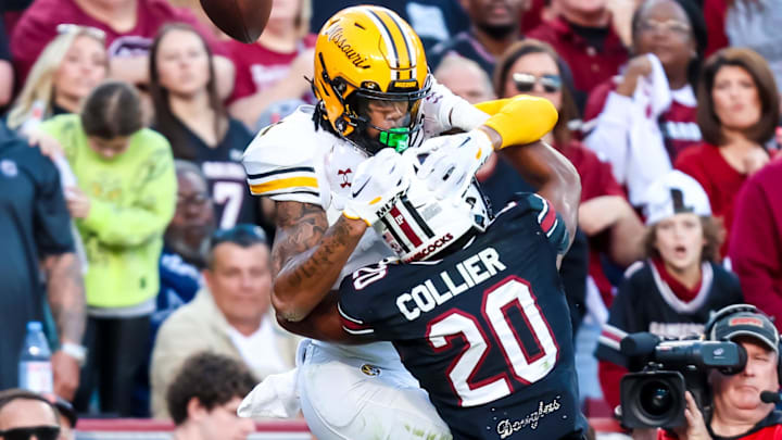 Nov 16, 2024; Columbia, South Carolina, USA; South Carolina Gamecocks defensive back Judge Collier (20) defends Missouri Tigers wide receiver Theo Wease Jr. (1) on an incomplete pass in the first quarter at Williams-Brice Stadium. Mandatory Credit: Jeff Blake-Imagn Images