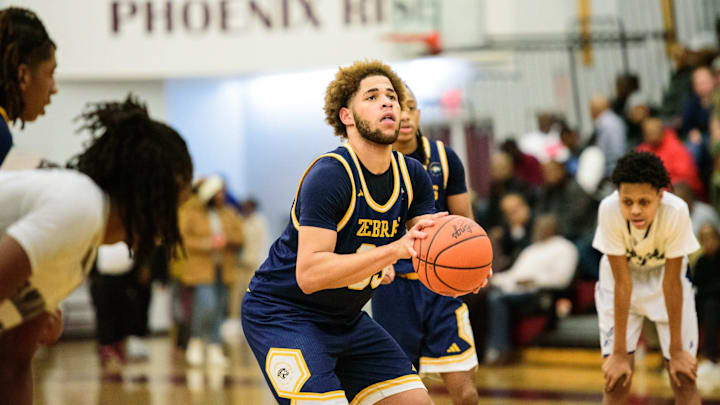 Wayne Memorial's Joshua Dennis shoots a free throw during the Division 1 boys basketball regional semifinal on Tuesday, March 4, 2025, at Detroit Renaissance High School.