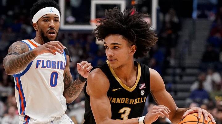 Vanderbilt guard Tyler Tanner (3) pushes past Florida guard Boogie Fland (0) during the first half of a SEC tournament semifinal game at Bridgestone Arena in Nashville, Tenn., Saturday, March 14, 2026. Vanderbilt guard Tyler Tanner (3) pushes past Florida guard Boogie Fland (0) during the first half of a SEC tournament semifinal game at Bridgestone Arena in Nashville, Tenn., Saturday, March 14, 2026.