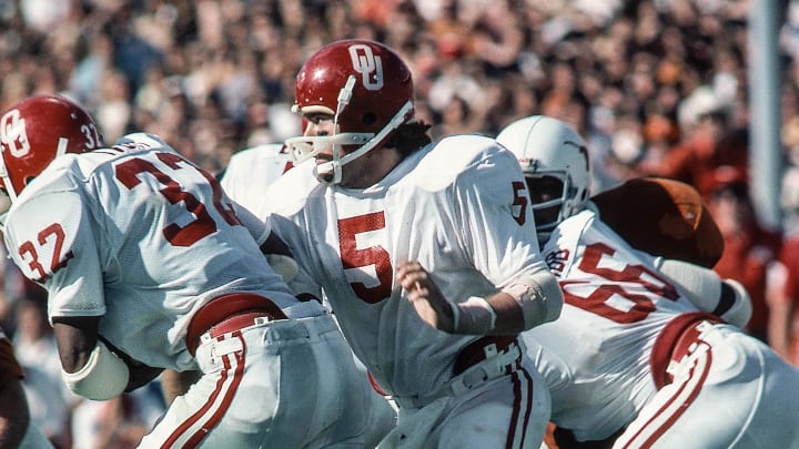 Oct 11, 1975, Dallas, TX, USA; FILE PHOTO; Oklahoma Sooners quarterback Steve Davis (5) hands the ball off to running back Horace Ivory (32) against the Texas Longhorns at the Cotton Bowl during the 1975 season. Mandatory Credit: Malcolm Emmons-USA TODAY Sports