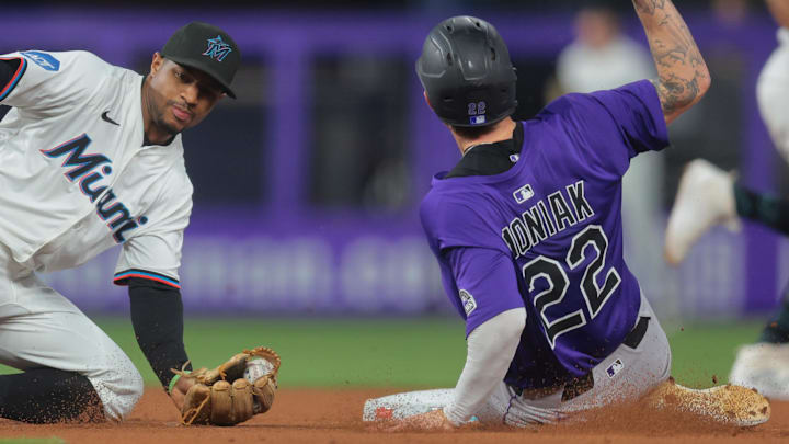 Jun 3, 2025; Miami, Florida, USA; Colorado Rockies right fielder Mickey Moniak (22) steals second base against Miami Marlins shortstop Xavier Edwards (9) during the fifth inning at loanDepot Park. Mandatory Credit: Sam Navarro-Imagn Images Jun 3, 2025; Miami, Florida, USA; Colorado Rockies right fielder Mickey Moniak (22) steals second base against Miami Marlins shortstop Xavier Edwards (9) during the fifth inning at loanDepot Park. Mandatory Credit: Sam Navarro-Imagn Images