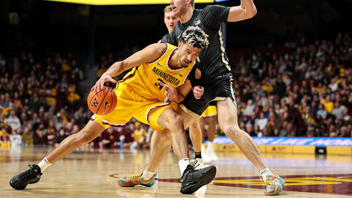 Jan 2, 2025; Minneapolis, Minnesota, USA; Minnesota Golden Gophers forward Dawson Garcia (3) drives towards the basket as Purdue Boilermakers forward Caleb Furst (1) defends during the first half at Williams Arena. Mandatory Credit: Matt Krohn-Imagn Images