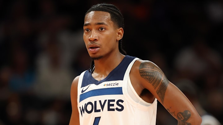 Nov 21, 2025; Phoenix, Arizona, USA; Minnesota Timberwolves guard Rob Dillingham (4) against the Phoenix Suns during an NBA Cup game at Mortgage Matchup Center. Mandatory Credit: Mark J. Rebilas-Imagn Images