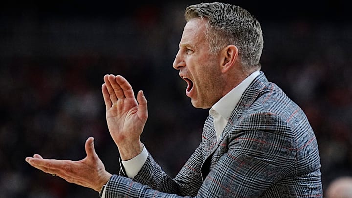 Alabama head coach Nate Oats encourages his team against Connecticut during the Final Four semifinal game at State Farm Stadium. Alabama head coach Nate Oats encourages his team against Connecticut during the Final Four semifinal game at State Farm Stadium.