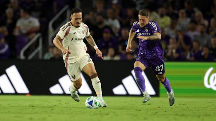Mar 22, 2025; Orlando, Florida, USA; D.C. United forward João Peglow (7) controls the ball from Orlando City forward Marco Pasalic (87) at Inter&Co Stadium. Mandatory Credit: Nathan Ray Seebeck-Imagn Images