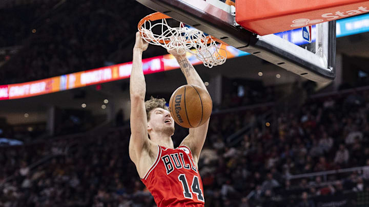 Dec 19, 2025; Cleveland, Ohio, USA; Chicago Bulls forward Matas Buzelis (14) dunks the ball against the Cleveland Cavaliers during the third quarter at Rocket Arena. Mandatory Credit: Scott Galvin-Imagn Images