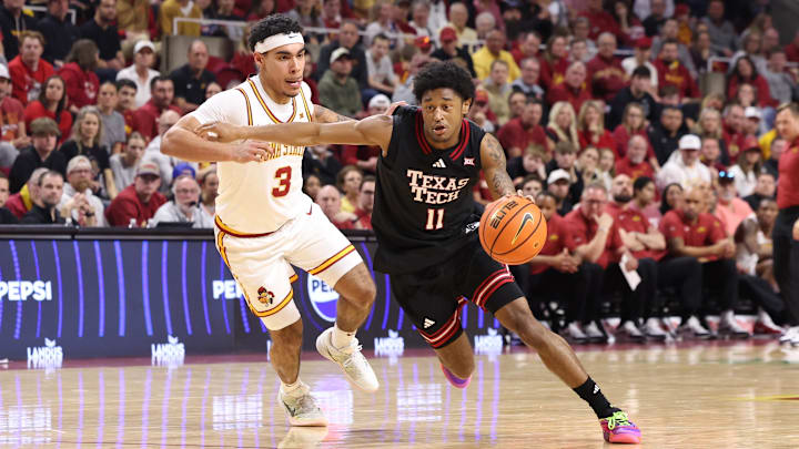 Feb 28, 2026; Ames, Iowa, USA; Texas Tech Red Raiders guard Jaylen Petty (11) drives past Iowa State Cyclones guard Tamin Lipsey (3) during the second half at James H. Hilton Coliseum. Mandatory Credit: Reese Strickland-Imagn Images