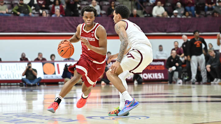 Jan 7, 2026; Blacksburg, Virginia, USA;  Stanford Cardinal guard Ebuka Okorie (1) drives with the basketball as Virginia Tech Hokies guard Jailen Bedford (0) defends during the second half at Cassell Coliseum. Mandatory Credit: Brian Bishop-Imagn Images
