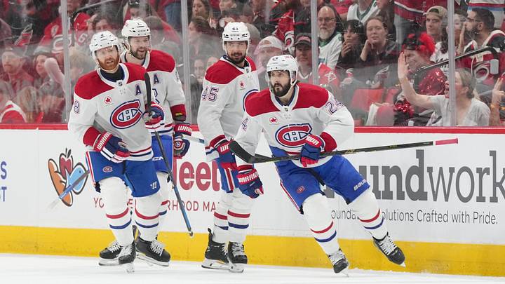 May 21, 2026; Raleigh, North Carolina, USA; Montreal Canadiens center Phillip Danault (24) celebrates with teammates after scoring a goal against the Carolina Hurricanes during the first period in game one of the Eastern Conferene Final of the 2026 Stanley Cup Playoffs at Lenovo Center. Mandatory Credit: James Guillory-Imagn Images