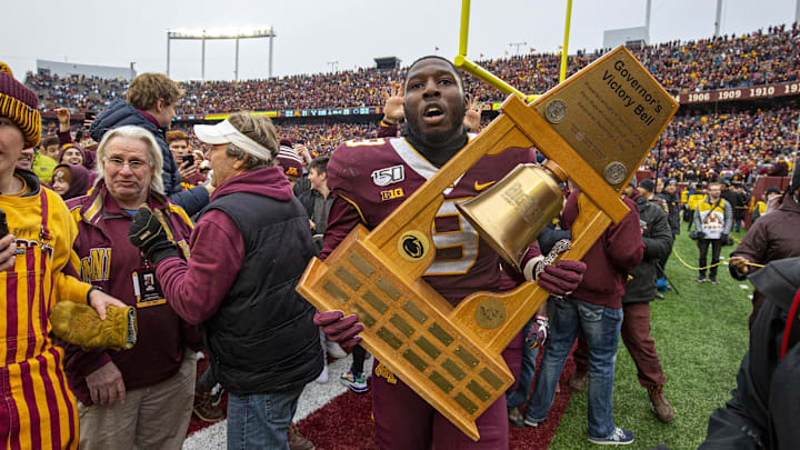 Nov 9, 2019; Minneapolis, MN, USA; Minnesota Golden Gophers defensive lineman Esezi Otomewo (9) holds the Governor Liberty Bell trophy after defeating the Penn State Nittany Lions at TCF Bank Stadium. Mandatory Credit: Jesse Johnson-Imagn Images Nov 9, 2019; Minneapolis, MN, USA; Minnesota Golden Gophers defensive lineman Esezi Otomewo (9) holds the Governor Liberty Bell trophy after defeating the Penn State Nittany Lions at TCF Bank Stadium. Mandatory Credit: Jesse Johnson-Imagn Images