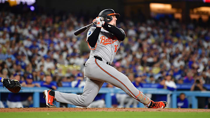Aug 27, 2024; Los Angeles, California, USA; Baltimore Orioles catcher Adley Rutschman (35) hits a single against the Los Angeles Dodgers during the third inning at Dodger Stadium. Mandatory Credit: Gary A. Vasquez-USA TODAY Sports Aug 27, 2024; Los Angeles, California, USA; Baltimore Orioles catcher Adley Rutschman (35) hits a single against the Los Angeles Dodgers during the third inning at Dodger Stadium. Mandatory Credit: Gary A. Vasquez-USA TODAY Sports