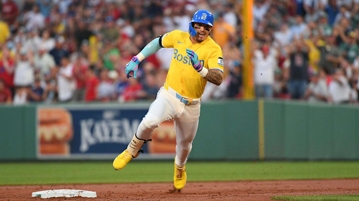 Boston, Massachusetts, USA; Boston Red Sox left fielder Jarren Duran (16) runs to third for a triple during the second inning against the Los Angeles Dodgers at Fenway Park.