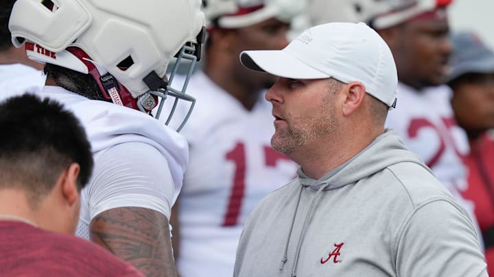 July 30, 2025; Tuscaloosa, AL, USA; Defensive coordinator Kane Wommack talks to defensive lineman London Simmons during the first practice session of the preseason for the Alabama Crimson Tide.