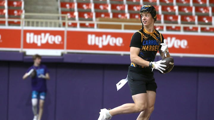 The Carroll Chargers’ Jaxx DeJean warms up before a 7-on-7 football tournament game Saturday, April 13, 2024 at the UNI Dome in Cedar Falls, Iowa.