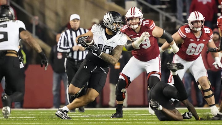 Nov 16, 2024; Madison, Wisconsin, USA;  Oregon Ducks linebacker Matayo Uiagalelei (10) intercepts a pass during the fourth quarter against the Wisconsin Badgers at Camp Randall Stadium.