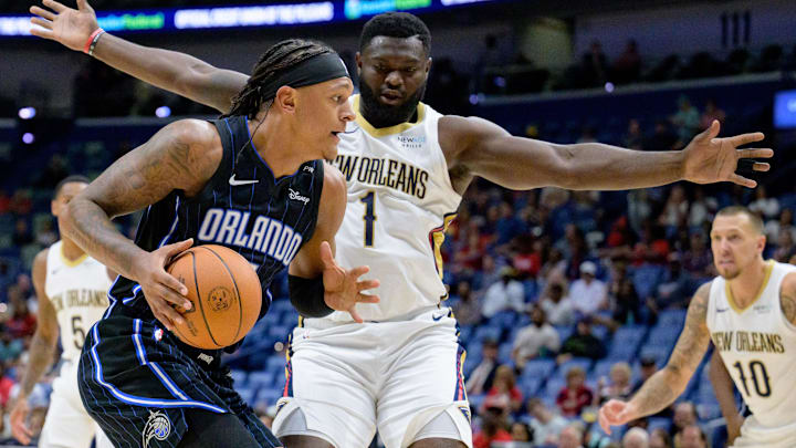 New Orleans Pelicans forward Zion Williamson (1) guards against Orlando Magic forward Paolo Banchero (5) during the first half at Smoothie King Center.