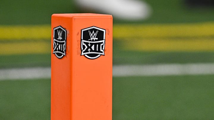 Dec 2, 2023; Arlington, TX, USA;  A view of the WWE wrestling logo on a touchdown pylon before the game between the Texas Longhorns and the Oklahoma State Cowboys at AT&T Stadium. Mandatory Credit: Jerome Miron-Imagn Images