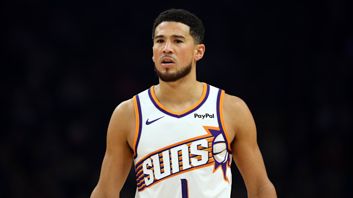 Nov 24, 2025; Phoenix, Arizona, USA; Phoenix Suns guard Devin Booker (1) against the Houston Rockets in the first half at Mortgage Matchup Center. Mandatory Credit: Mark J. Rebilas-Imagn Images