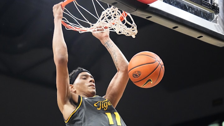 Dec 14, 2024; Columbia, Missouri, USA; Missouri Tigers guard Trent Pierce (11) dunks the ball against the LIU Sharks during the first half at Mizzou Arena. Mandatory Credit: Denny Medley-Imagn Images