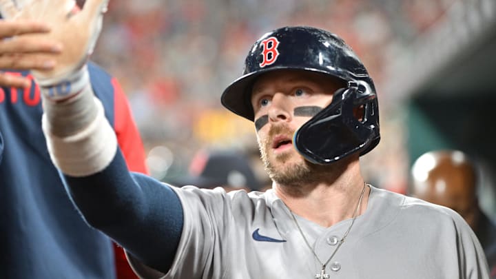 Apr 10, 2026; St. Louis, Missouri, USA; Boston Red Sox shortstop Trevor Story (10) is congratulated in the dugout after scoring in the fourth inning against the St. Louis Cardinals at Busch Stadium. Mandatory Credit: Tim Vizer-Imagn Images