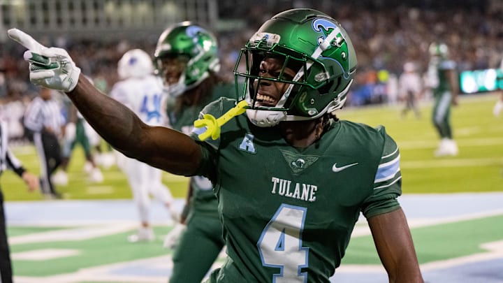 Nov 28, 2024; New Orleans, Louisiana, USA; Tulane Green Wave wide receiver Mario Williams (4) celebrates a touchdown reception against Memphis Tigers defensive back Greg Rubin (not pictured) during the first quarter at Yulman Stadium.