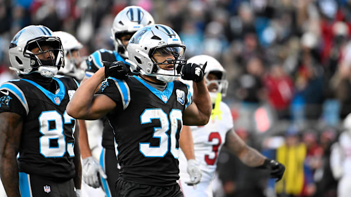 Dec 22, 2024; Charlotte, North Carolina, USA;  Carolina Panthers running back Chuba Hubbard (30) reacts after running for a first down in overtime at Bank of America Stadium. Mandatory Credit: Bob Donnan-Imagn Images