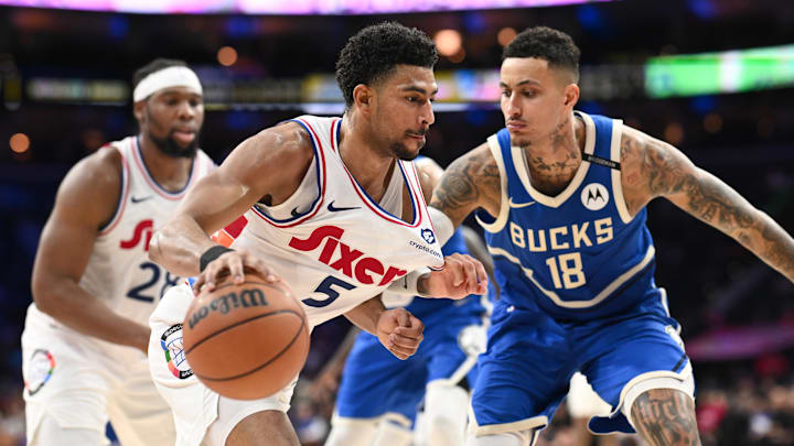 Apr 3, 2025; Philadelphia, Pennsylvania, USA; Philadelphia 76ers guard Quentin Grimes (5) drives against Milwaukee Bucks forward Kyle Kuzma (18) in the fourth quarter at Wells Fargo Center. Mandatory Credit: Kyle Ross-Imagn Images