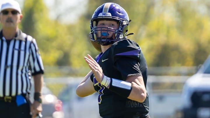 Western Beaver quarterback Jaivin Peel (7) looks to throw a pass towards the sideline during the second half of the Golden Beavers Midwestern Conference game against Ellwood City in Week 6 at Rich Niedbala Field.