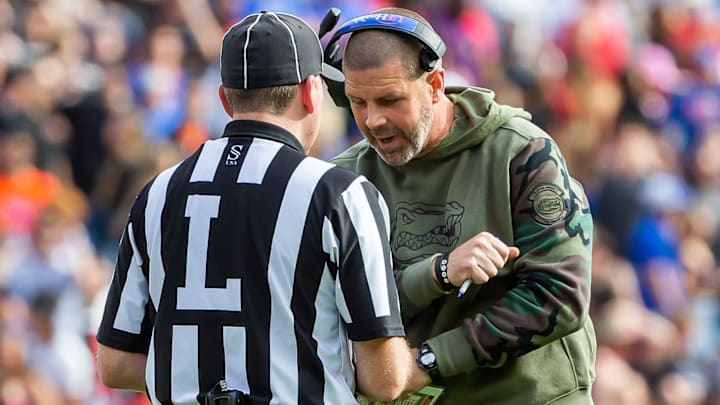 Florida Gators head coach Billy Napier has words with a lineman referee at Steve Spurrier Field at Ben Hill Griffin Stadium in Gainesville, FL on Saturday, November 4, 2023 in the second half. Arkansas defeated Florida 39-36 in over-time. [Doug Engle/Gainesville Sun]