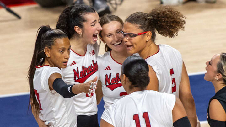 Members of the Husker Volleyball team celebrate after a Rebekah Allick kill in the second set of the first match of the AVCA First Serve vs. Pittsburg Members of the Husker Volleyball team celebrate after a Rebekah Allick kill in the second set of the first match of the AVCA First Serve vs. Pittsburg